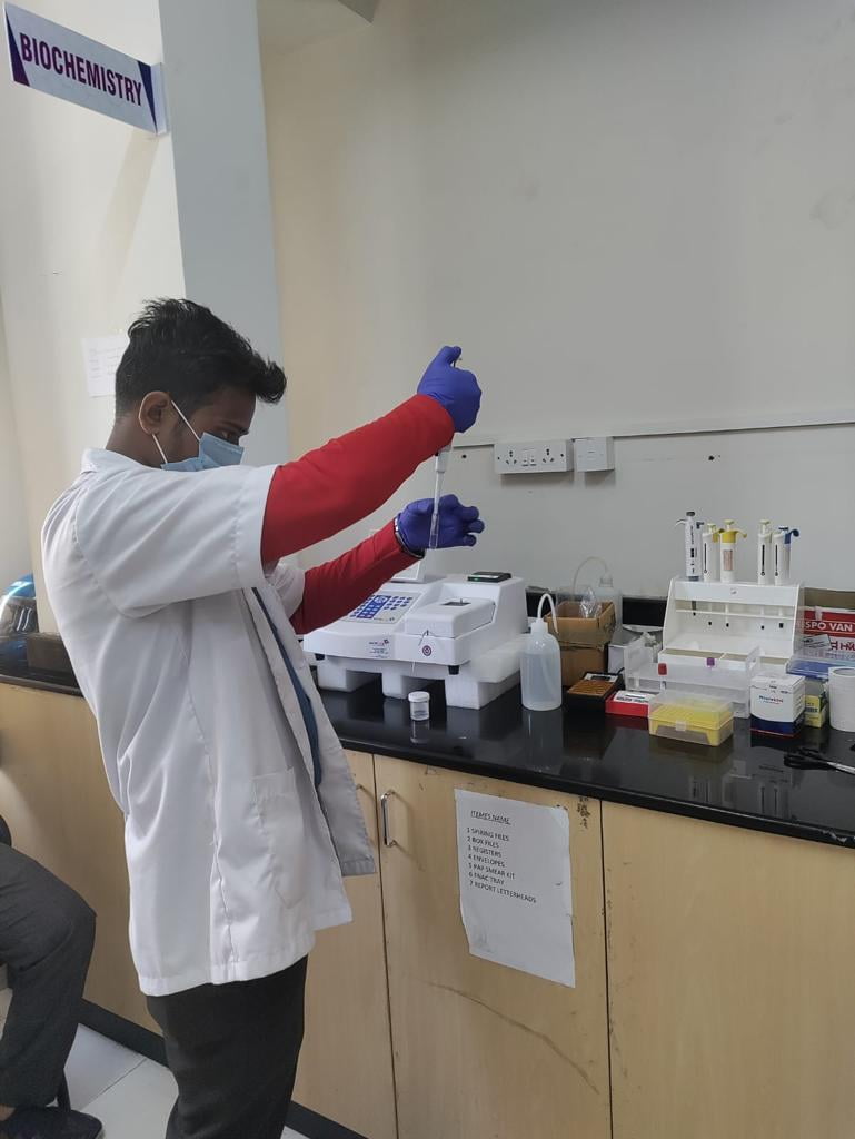 Student performing lab test